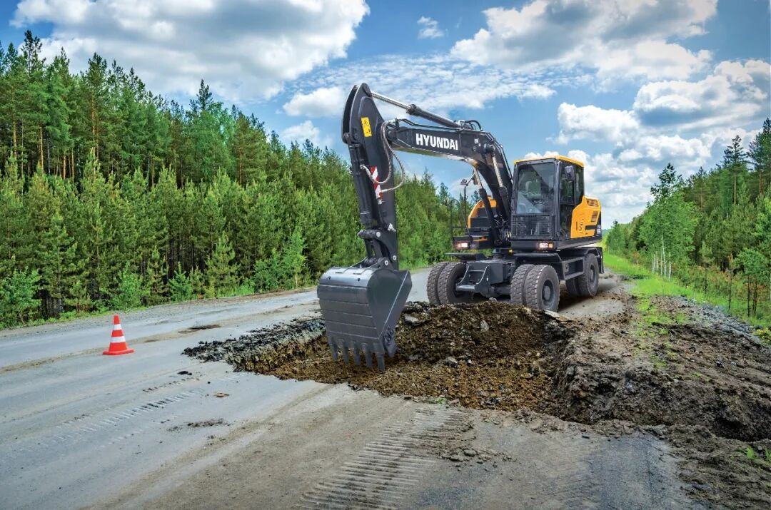 Hyundai HW155 Wheeled Excavator Working on a Roadside Municipal Project