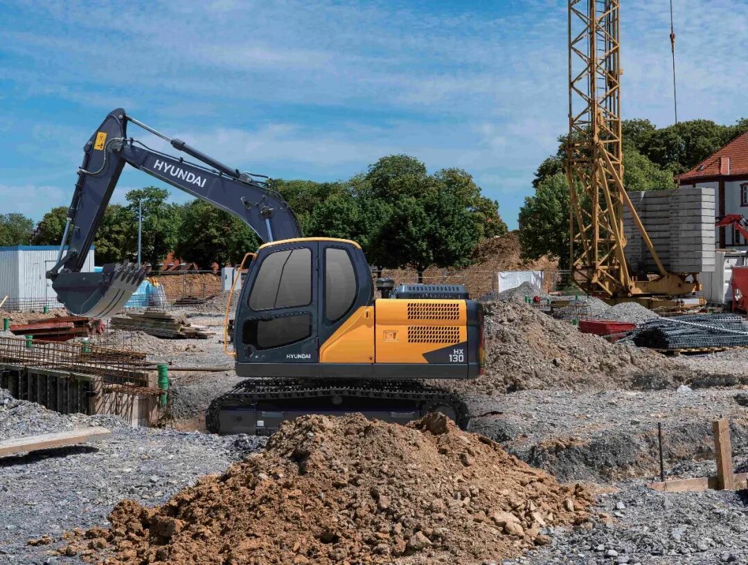 Hyundai HX130 Compact Crawler Excavator Digging on a Construction Site Hyundai HX130 Compact Crawler Excavator Digging on a Construction Site