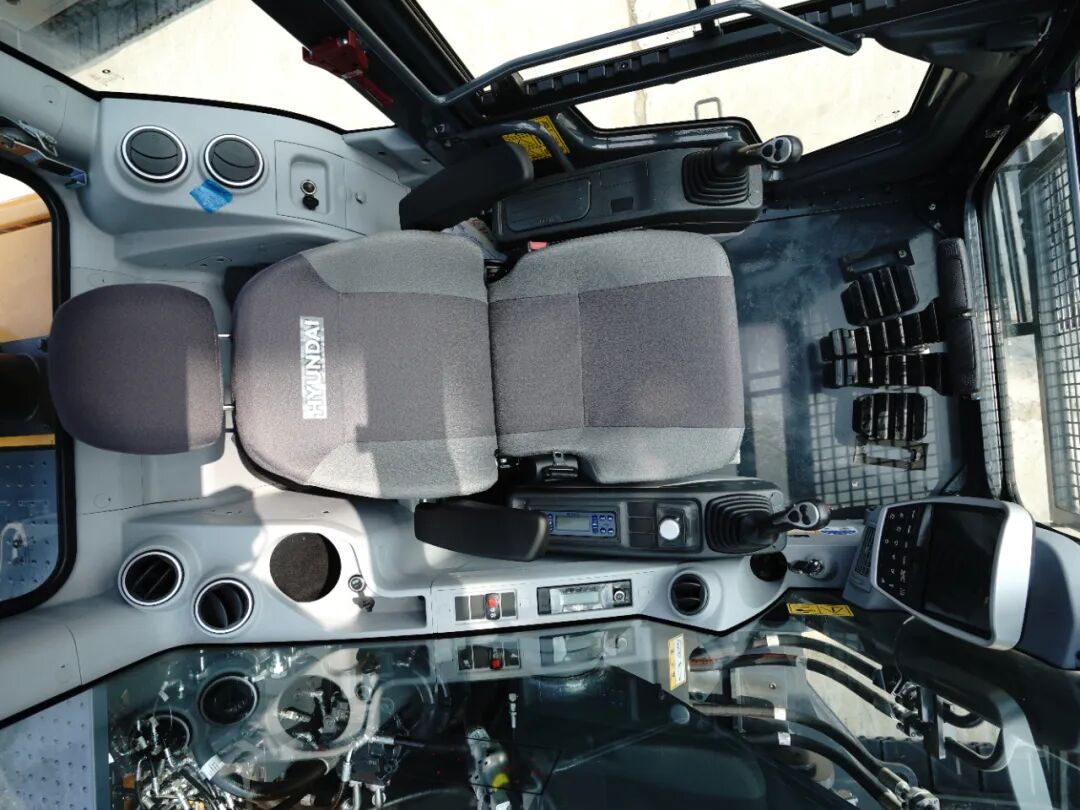 Cab Interior with Suspension Seat of the Hyundai HX220PRO Cab Interior with Suspension Seat of the Hyundai HX220PRO